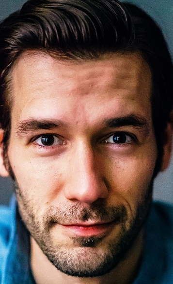 Актер Джон Белманн