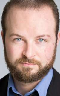 Актер Джастин Джералд Морк